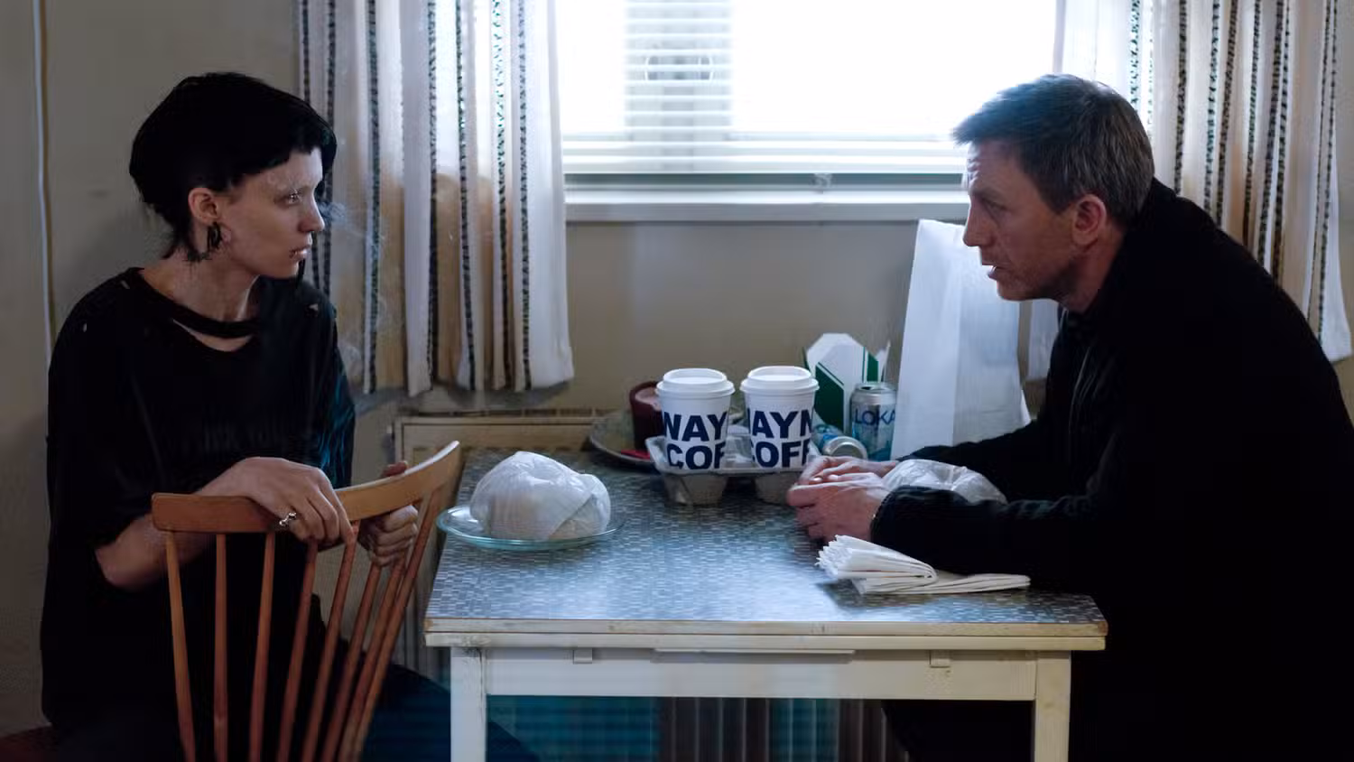 Screenshot from The Girl with the Dragon Tattoo starring Rooney Mara and Daniel Craig.